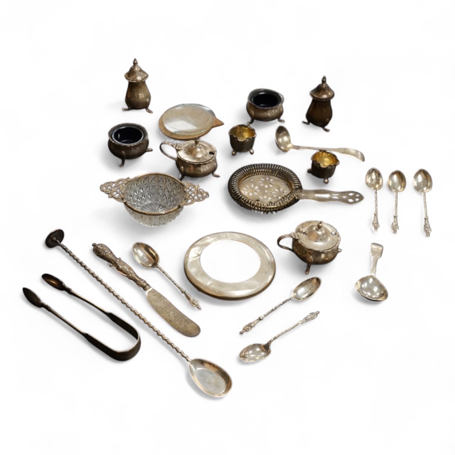 A George V six piece silver condiment set by Mappin & Webb, Birmingham, 1925, two George V silver mounted photograph frames, a small pair of late Victorian silver salts, a silver mounted cut glass dish, a set of six silv